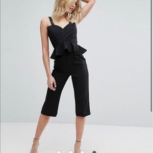 Black Peplum Plunge Jumpsuit size 10